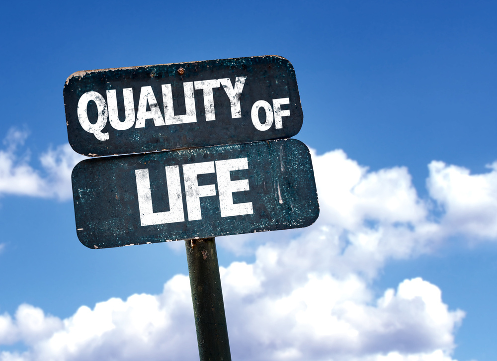 Quality of Life sign with sky background