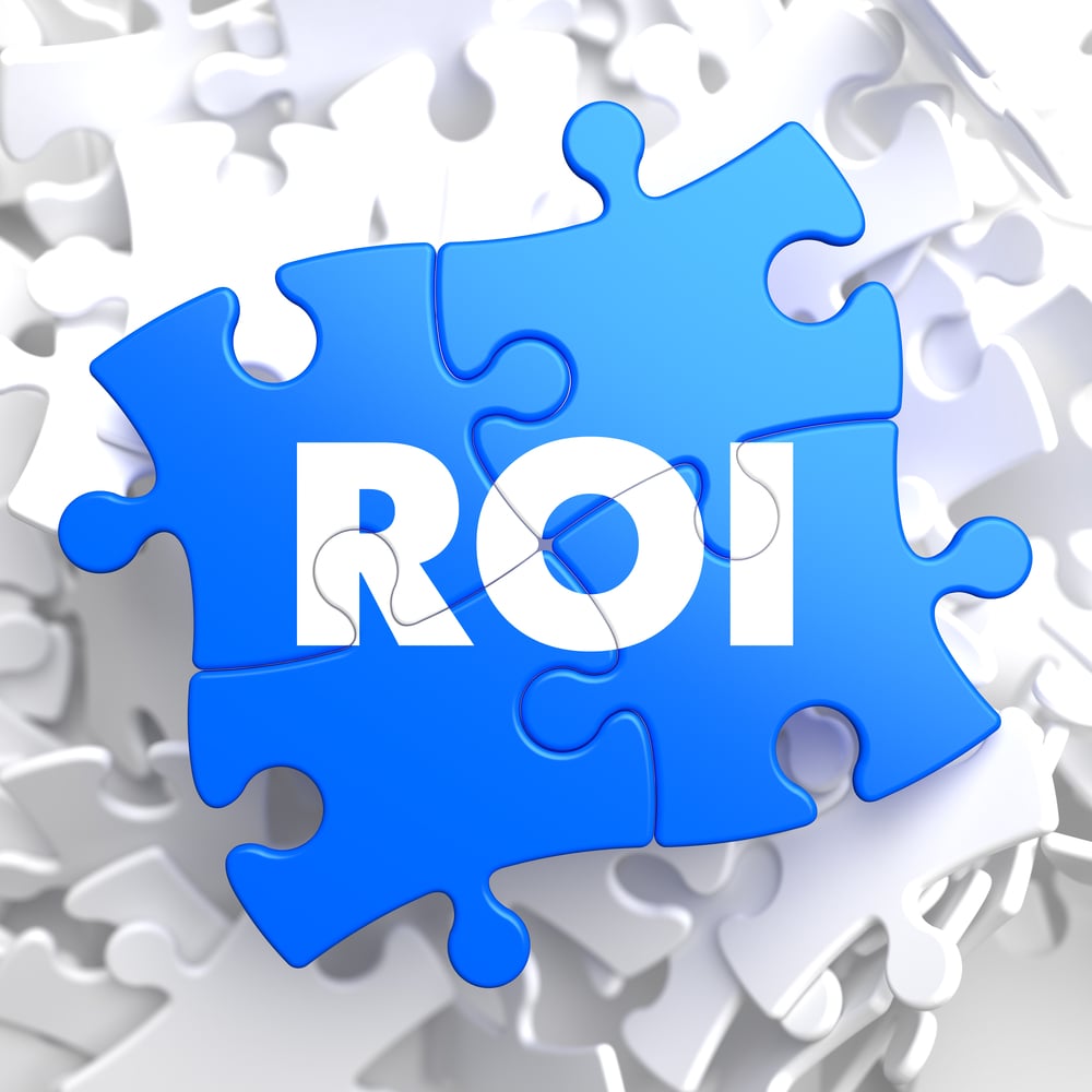 ROI - Return Of Investment - Written on Blue Puzzle Pieces. Business Concept.